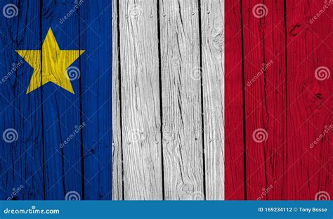 Acadian Flag On Pole With Lobster Cages In Field And Clapboard Houses
