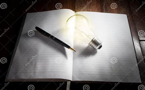 Light Bulb With Pen On Book Stock Image Image Of Glowing Education