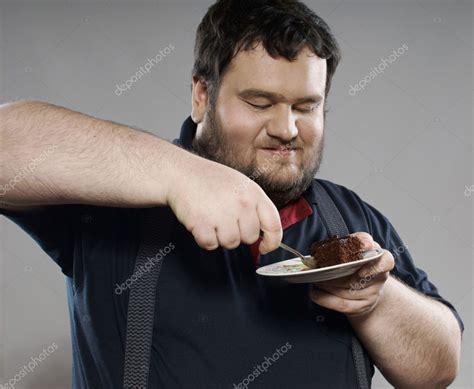 Funny Fat Guy Eating Chocolate Cake — Stock Photo © Dmitryzubarev 8175895