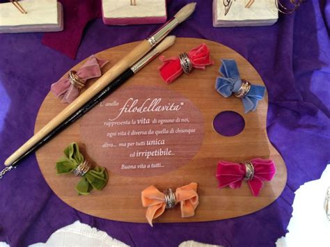 A Wooden Cutting Board Topped With Lots Of Different Colored Bows