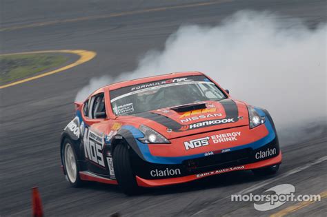 64 Chris Forsberg NOS Energy Drink Nissan 370Z At Wall