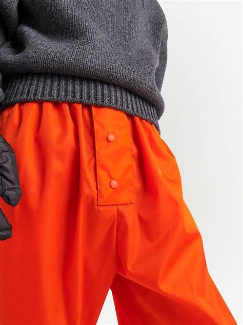Prada Re-Nylon Track Pants | Orange | FARFETCH