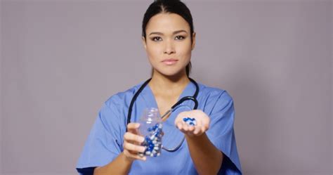 Beautiful Latina Female Doctor With Bunch Of Pills Stock Footage VideoHive