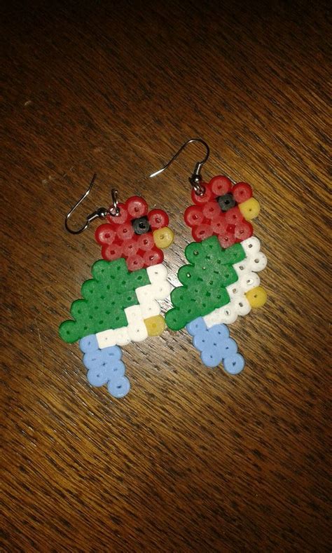 The Earrings Are Made Out Of Legos And Have Red White Green And Blue