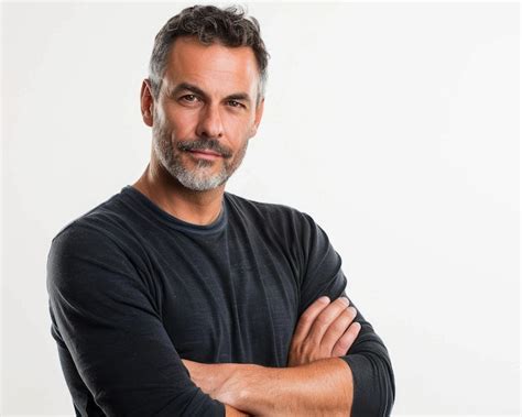 Man With Arms Folded Portrait Of Smiling Mature Man With Confidence