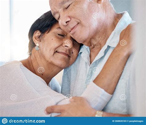 Calm Senior Couple Hug With Love Care And Romance In Home Man Woman