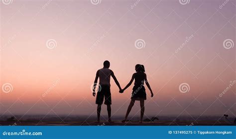 Silhouette Of Couple Holding Hand At Sunset Stock Image Image Of