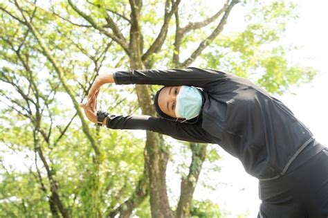 Premium Photo | Woman with muslim sport wear stretching