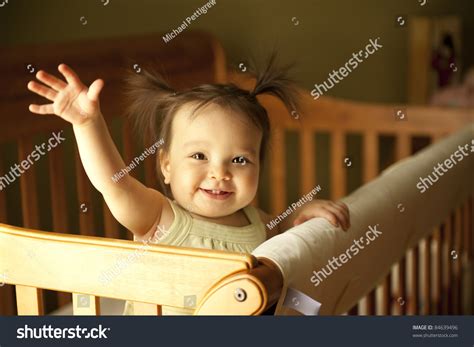 Baby Girl Waving Hand Standing Crib Stock Photo 84639496 Shutterstock