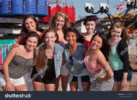 Group Of 8 Happy Female Teens At An Amusement Park Stock Photo ...