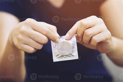 Condom Ready To Use In Male Hand Give Condom Safe Sex Concept On The