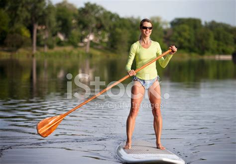 Athletic Woman Paddle Boarding on A Calm Midwestern Stock Photos ...