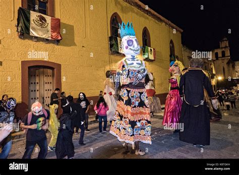 Giant Paper Mache Puppets Called Mojigangas Lead A Procession Through