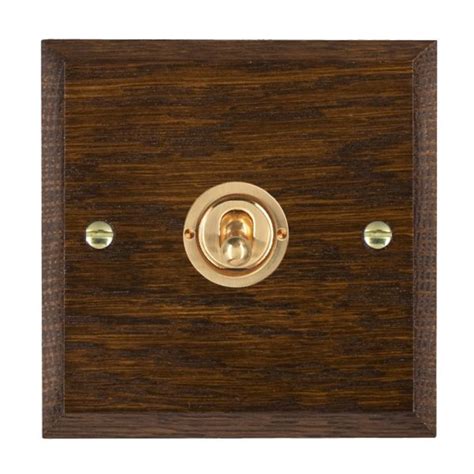 Hamilton Woods Chamfered Dark Oak 1 Gang 20ax 2 Way Toggle Switch With Polished Brass Toggle Ukes