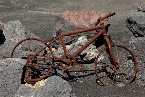 Rusty Bike Among Boulders Stock Photo Dissolve