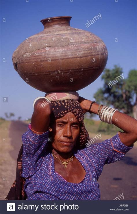 Download This Stock Image India A Rajasthani Woman Carrying Water Pot A8f0e6 From Alamy S