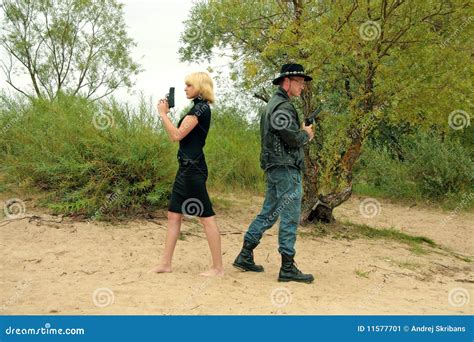 Two people with guns, duel stock image. Image of criminal - 11577701