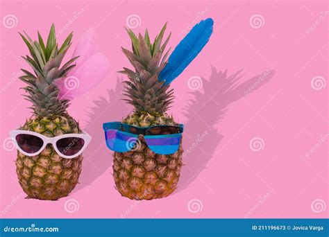 Female And Male Pineapple Hipster In Sunglasses Stylish Fruit Couple Minimal Concept Stock