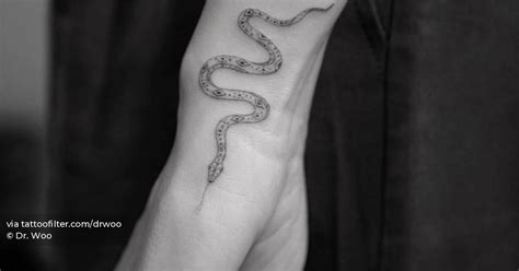 Single Needle Snake Tattoo Located On Georgie Flores