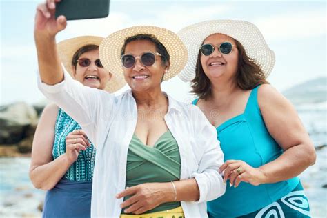 We Know All About This Selfie Trend A Mature Group Of Friends Standing Together And Using A