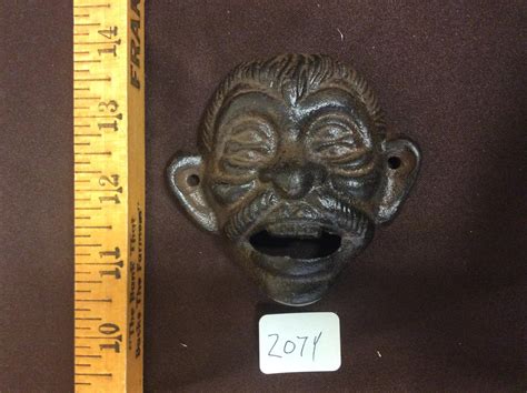 Lot Cast Iron Bottle Opener Face