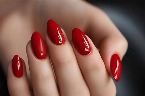 Premium Photo Womans Hands With Red Nail Polish