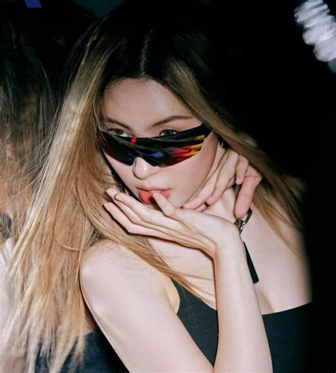 A Woman With Long Hair Wearing Sunglasses