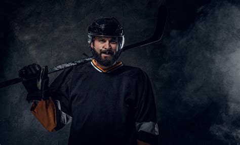 Free Photo Happy Toothless Hockey Player Is Posing For Photographer