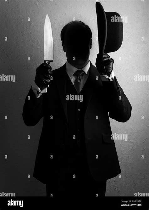 Portrait Of Shadow Man In Dark Suit Holding Bowler Hat And Sharp Knife