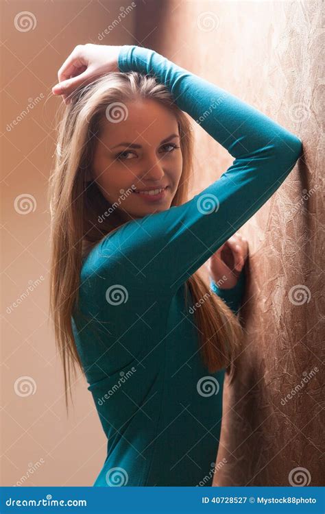 Young Woman Leaning Against Wall Stock Image Image Of Attractive