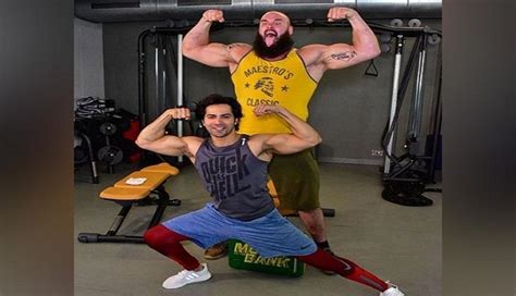 Varun Dhawan Flexes With Wwe Superstar Braun Strowman Catch News