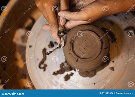 Close Up On Skillful Hands Sculpting Pottery Jar On Potter Wheel Stock