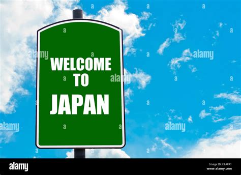 Green road sign with greeting message WELCOME TO JAPAN isolated over ...