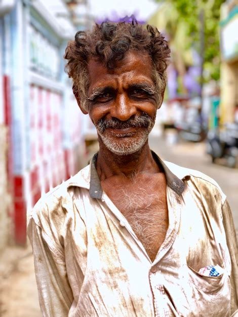 Premium Photo Close Up Portrait Of Smiling Man Standing On Street