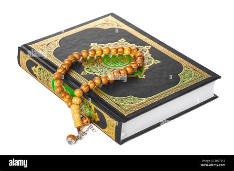 Islamic Book Holy Quran and beads on withe background Stock Photo - Alamy