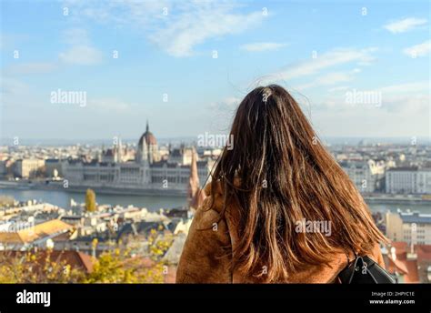 Female With Long Hair Admiring The View Of The City Of Budapest