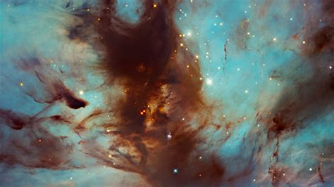 Hubble peers into 'dark, dusty heart' of the stunning Flame Nebula - CNET