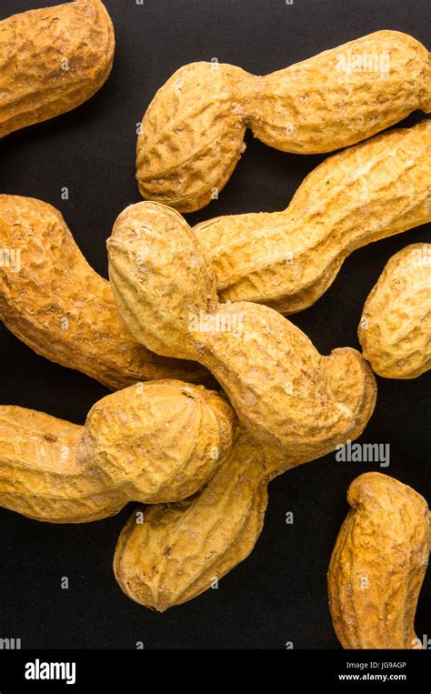 Peanuts Arachis Hypogaea In Shell On Dark Background Close Up