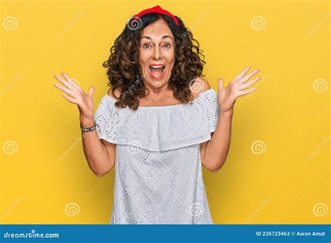 Middle Age Hispanic Woman Wearing Casual Clothes Celebrating Victory