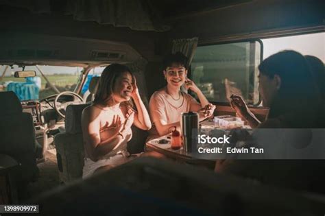 Asian Chinese Lesbian Couple And Friends Enjoying Breakfast In