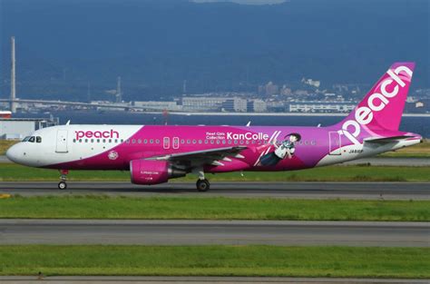 Download Peach Aviation Airplane On Runway Wallpaper