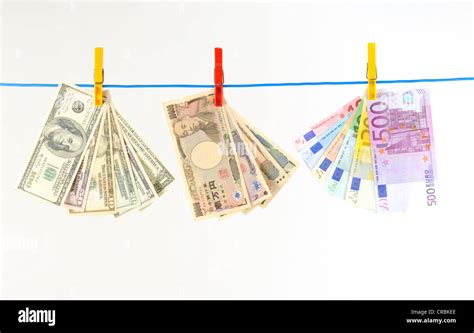 Euro, U.S. dollars and Japanese yen, notes on a clothesline, symbolic ...