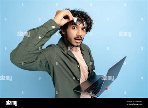 Shocked Amazed Indian Or Arabian Guy In Casual Wear Take Off Glasses