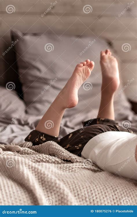 Girl Laying On The Bed Legs And Feet Stock Photo Image Of Sleepy