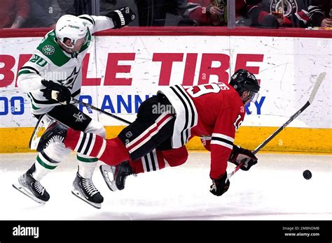 Chicago Blackhawks Center Jonathan Toews Right Is Checked By Dallas