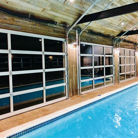 Indoor Pool With Glass Garage Doors Indoor Swimming Pool Design Indoor Pool House Indoor