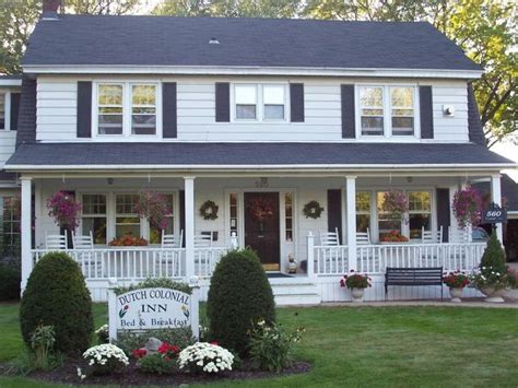 Dutch Colonial Inn Colonial Porch Curb Appeal Ideas And Inspiration With Columns And Railing