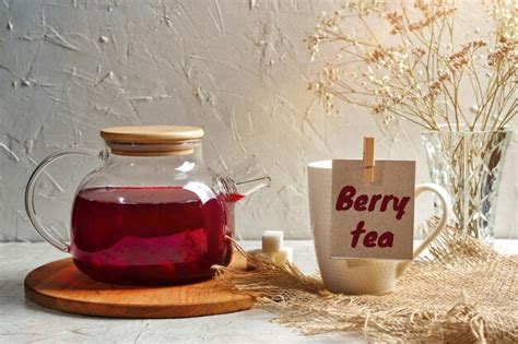 Premium Photo Hot Fruit Berry Tea In Glass Teapot And Cup With Red Antioxidant Beverage Good