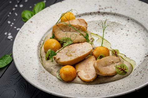 Fried Bull Testicles With Potatoes And Mushroom Sauce Stock Image