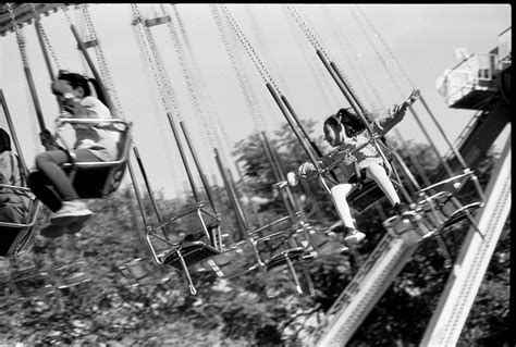 Happy Children on Swings in Amusement Park · Free Stock Photo